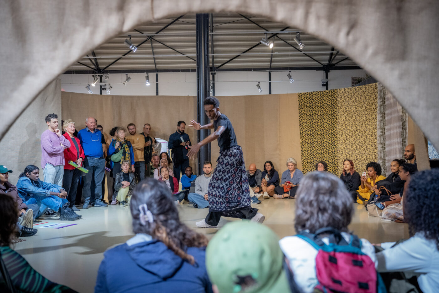 Salman Dirir performing at the opening of the exhibition The Anarchist Citizenship: People Made of Stories (2024/2025) by Framer Framed, Amsterdam. © Farouk Ebaiss @TheMomentory / Framer Framed.