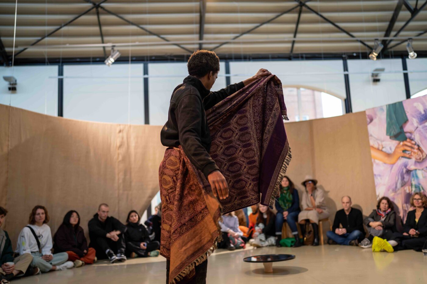 Salman Dirir performing at the finissage of the exhibition The Anarchist Citizenship: People Made of Stories (2024)  at Framer Framed, Amsterdam. © Hemanth Madupu / Framer Framed.