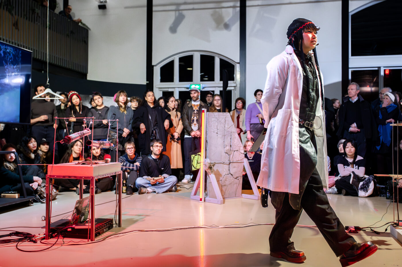 Performance 'The Burial of a Brown Goose' by buulbuul at the opening of Between Fires – Irradiated Imaginations & Anti-Nuclear Solidarities (2026) at Framer Framed, Amsterdam. Photo: © Marlise Steeman / Framer Framed